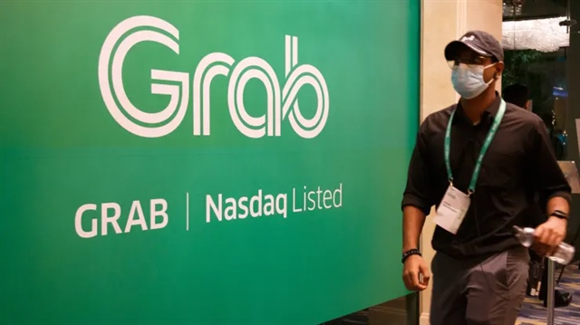Grab lần đầu báo lãi